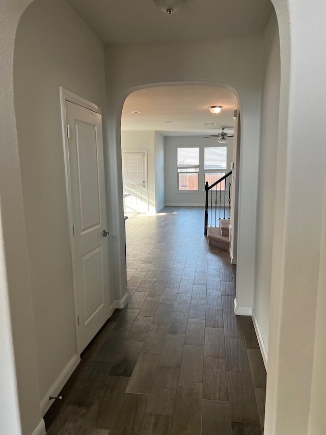 hallway with dark wood-type flooring