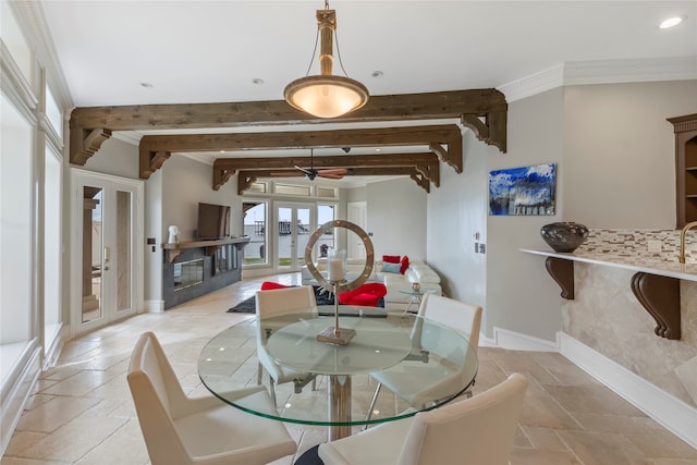 dining area featuring french doors, ceiling fan, and beam ceiling