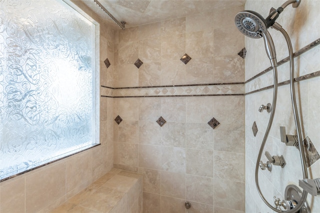 bathroom with tiled shower