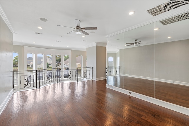 spare room with ceiling fan, wood-type flooring, and ornamental molding