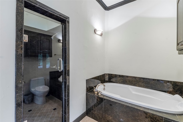 bathroom with tile patterned flooring, toilet, and independent shower and bath