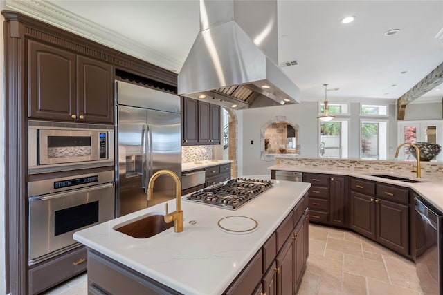 kitchen with built in appliances, a kitchen island with sink, sink, and island exhaust hood