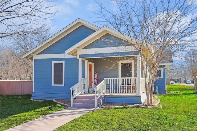 bungalow-style house featuring a front lawn and a porch