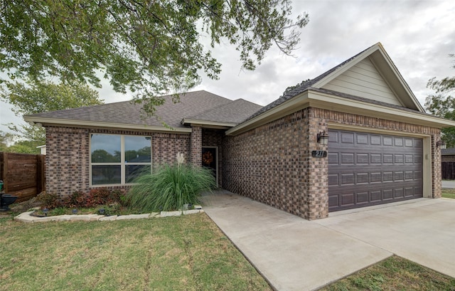 ranch-style home with a garage and a front yard