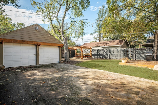 view of yard with an outdoor structure and fence