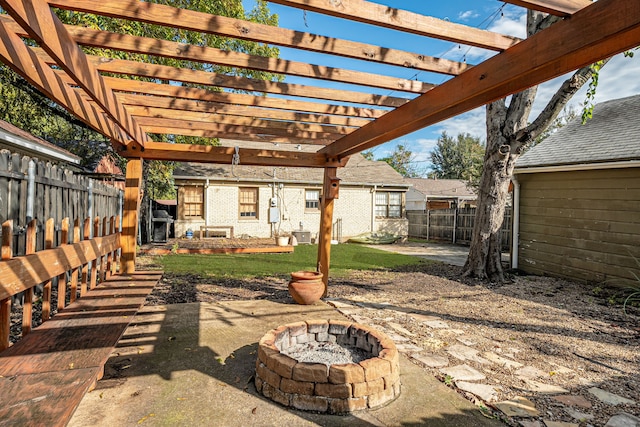 view of patio featuring a pergola and an outdoor fire pit