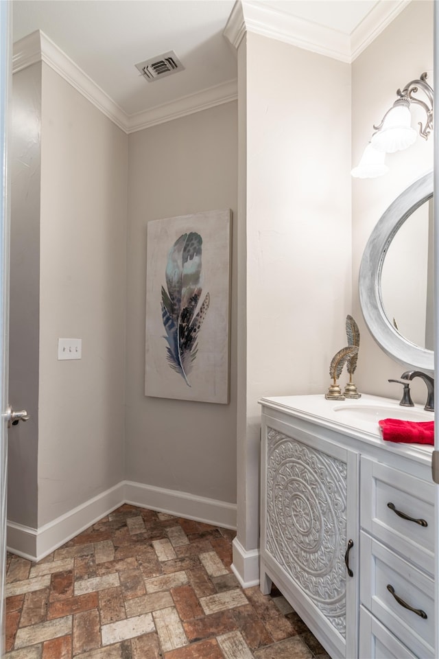 bathroom with vanity and ornamental molding