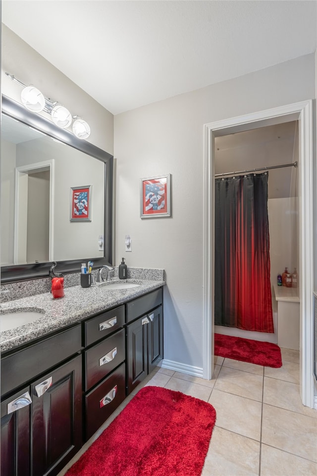 bathroom with vanity, shower / tub combo with curtain, and tile patterned floors