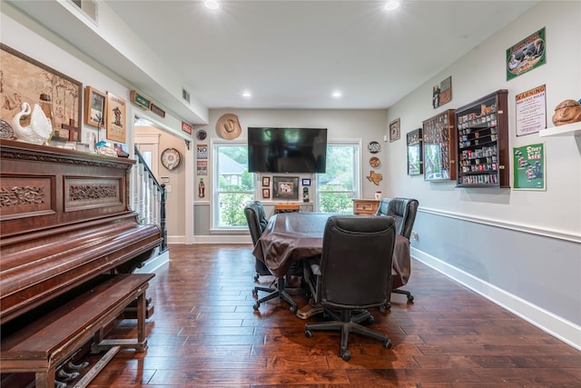 dining area with dark hardwood / wood-style floors