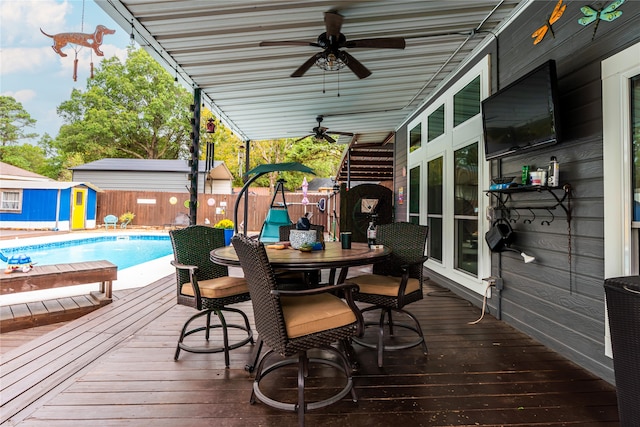 wooden deck featuring french doors and ceiling fan