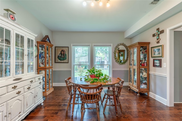 dining area featuring dark hardwood / wood-style floors