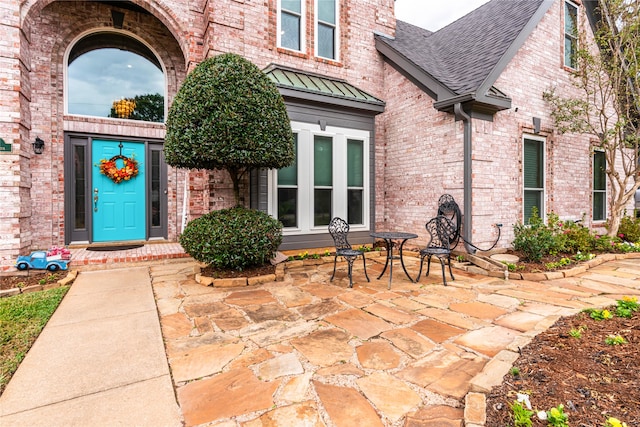 doorway to property featuring a patio