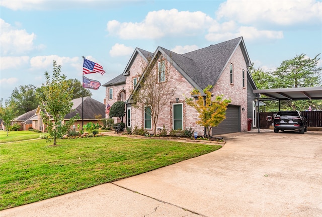 view of front of home with a front yard, a carport, and a garage