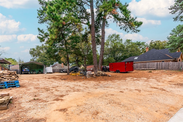 view of yard with a carport