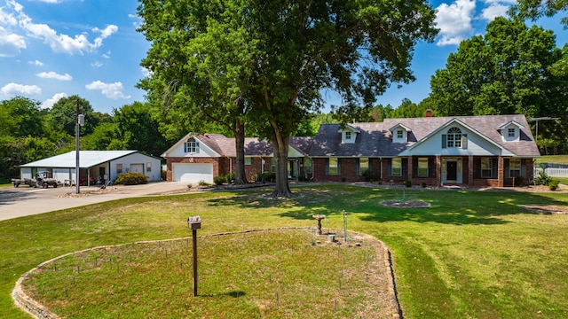 view of front of property with a garage and a front yard