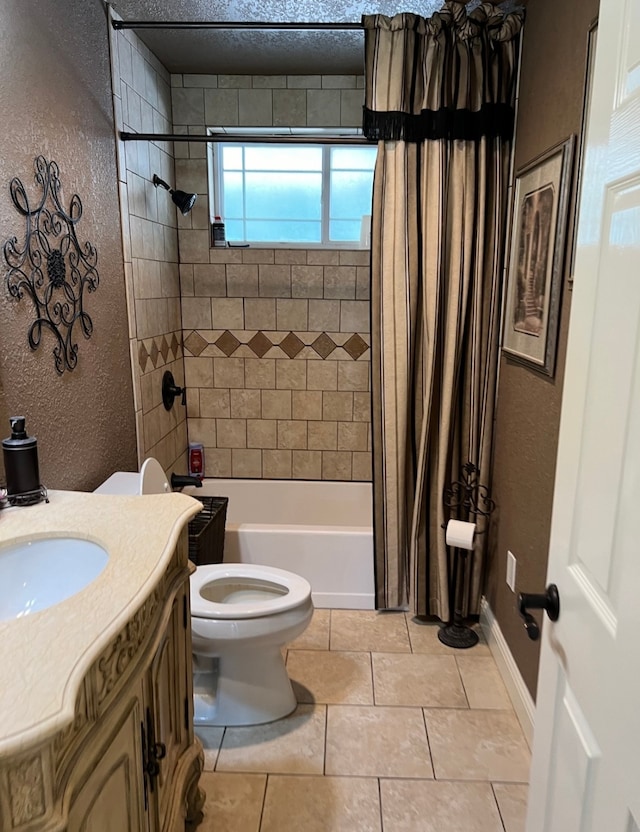 full bathroom featuring vanity, a textured ceiling, shower / tub combo, tile patterned flooring, and toilet