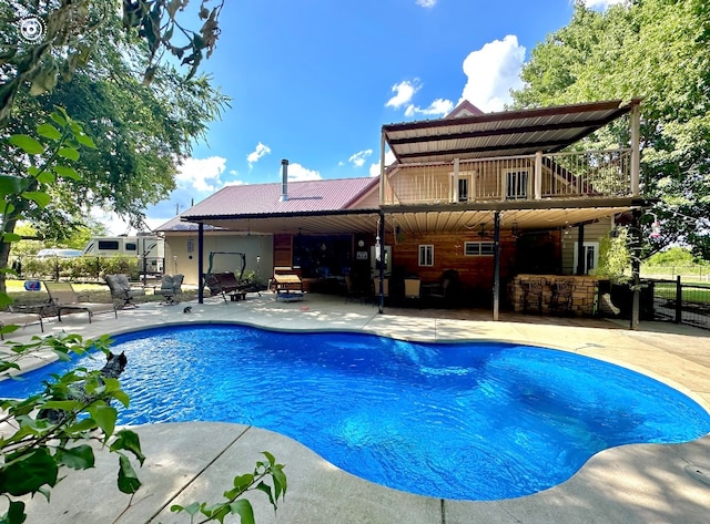 view of swimming pool featuring a patio area