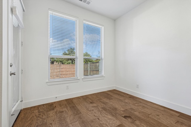 unfurnished room featuring wood-type flooring