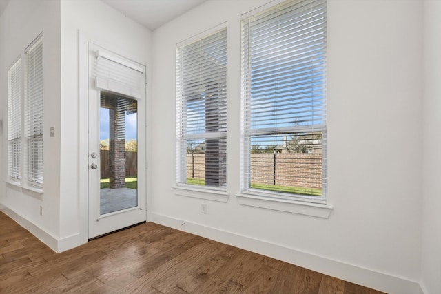 doorway to outside with hardwood / wood-style flooring