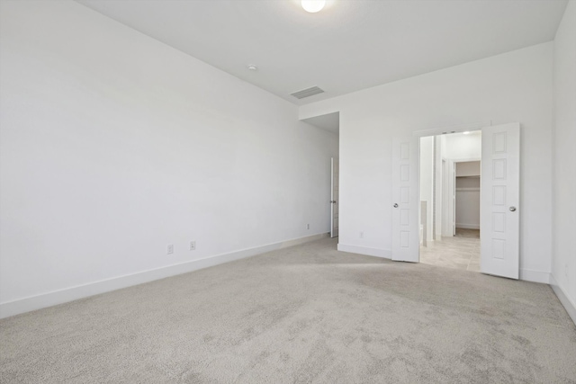 unfurnished bedroom featuring light colored carpet