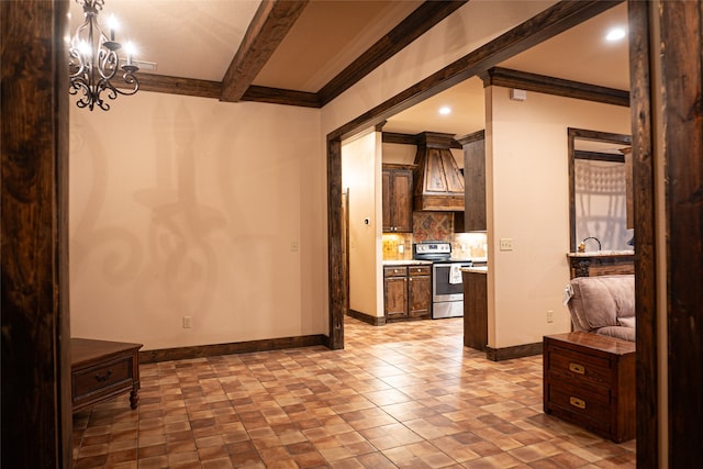 interior space featuring a chandelier, ornamental molding, and beam ceiling