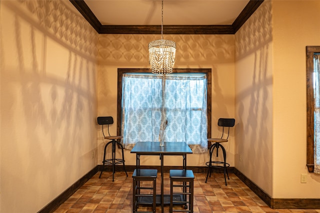 dining room featuring ornamental molding and a chandelier