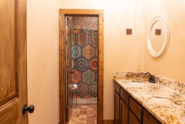 bathroom with a shower with curtain and vanity