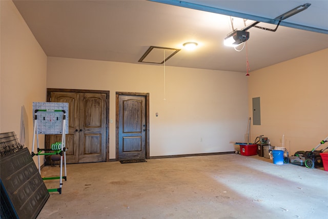 garage featuring a garage door opener and electric panel