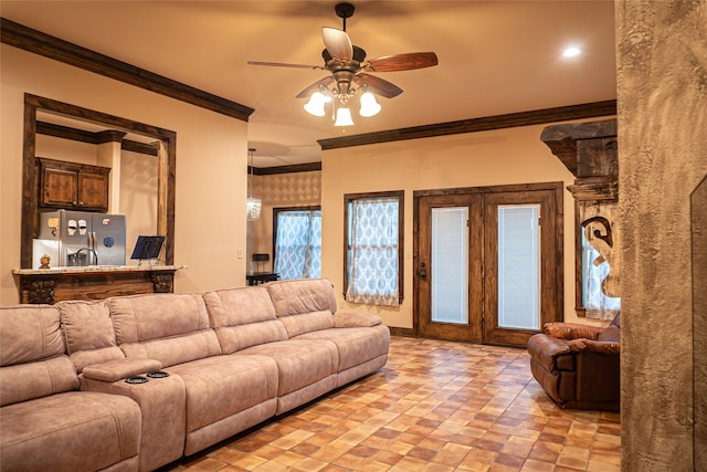 living room with ceiling fan and crown molding