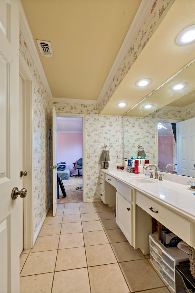 bathroom with crown molding, vanity, and tile patterned flooring