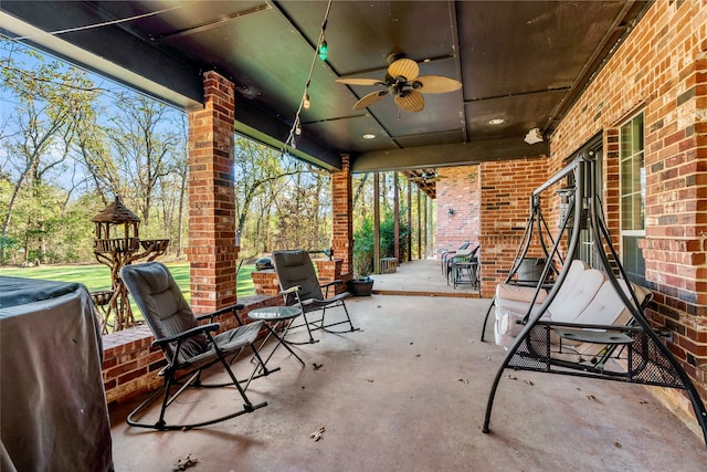 view of patio featuring area for grilling and ceiling fan