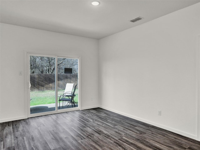 empty room with dark wood-type flooring