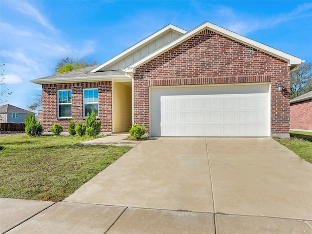 view of front of house featuring a garage and a front lawn