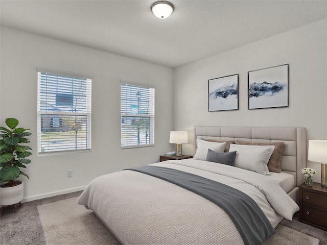 bedroom featuring light colored carpet