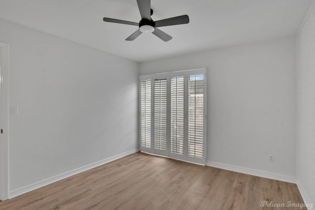 spare room featuring ceiling fan and light hardwood / wood-style floors