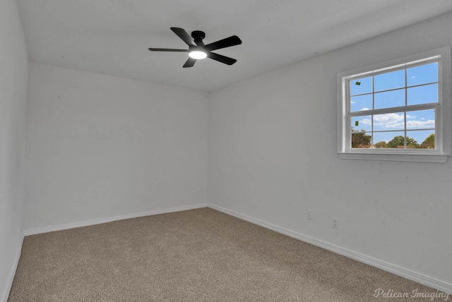 carpeted empty room featuring ceiling fan