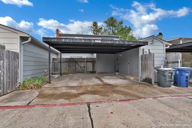 exterior space with a carport