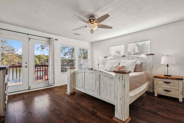 bedroom featuring french doors, dark hardwood / wood-style flooring, access to exterior, a textured ceiling, and ceiling fan