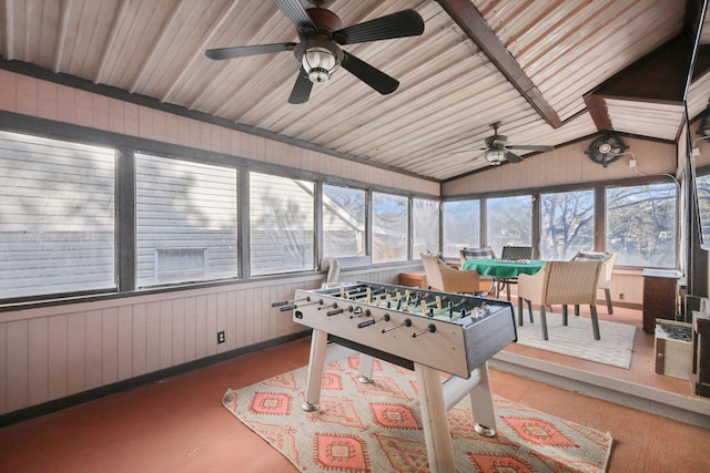 playroom with plenty of natural light, lofted ceiling, and ceiling fan