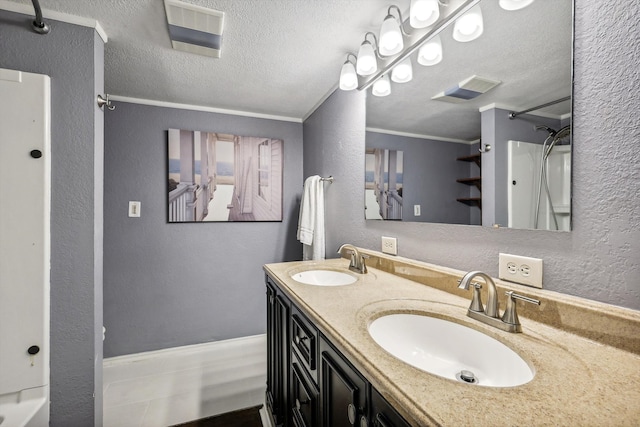 bathroom with vanity, a textured ceiling,  shower combination, and crown molding