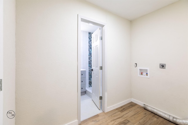 2318 May Ln, Grand Prairie, TX 75050 - washroom featuring electric dryer hookup, hookup for a washing machine, light wood-type flooring, and baseboards