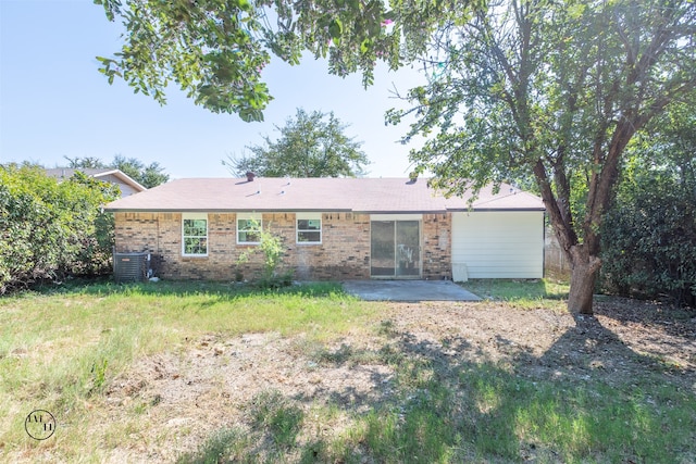 rear view of house with a patio and cooling unit