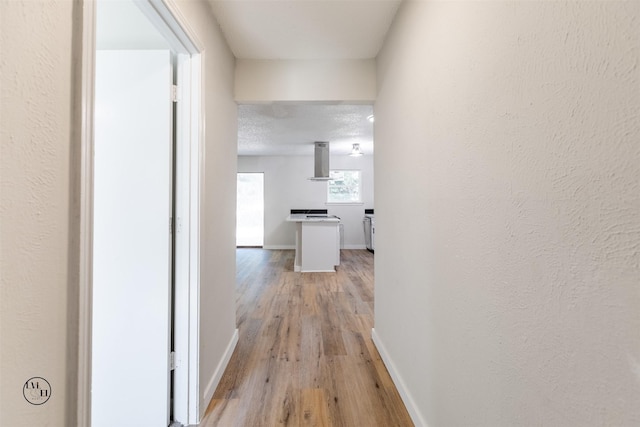 2318 May Ln, Grand Prairie, TX 75050 - corridor featuring light wood-style flooring and baseboards