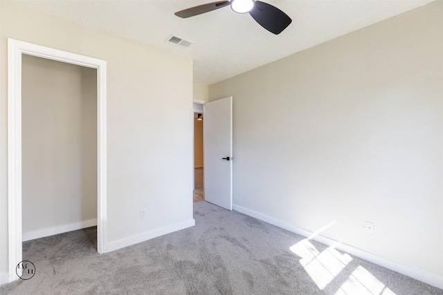 2318 May Ln, Grand Prairie, TX 75050 - unfurnished bedroom featuring carpet, baseboards, and a ceiling fan