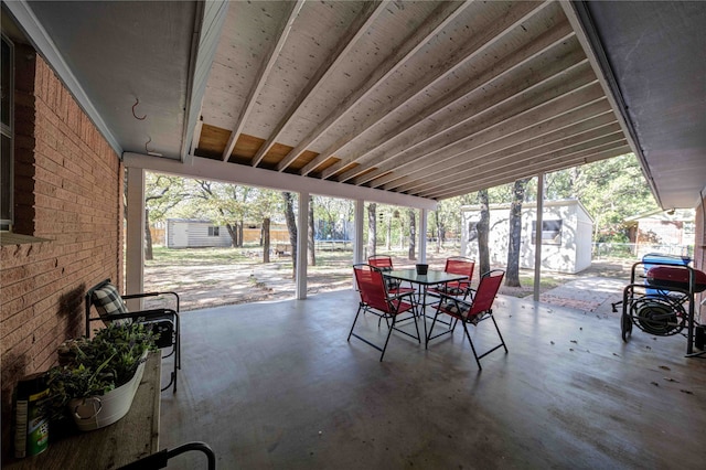 view of patio featuring a shed