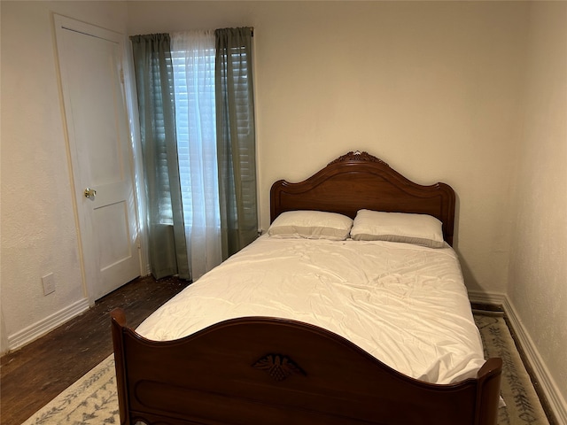 bedroom featuring dark hardwood / wood-style floors