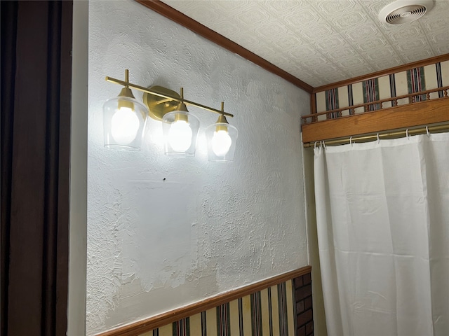 bathroom featuring crown molding