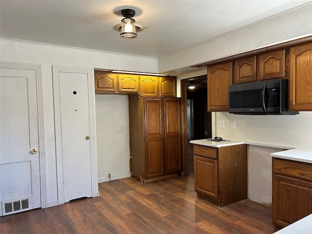 kitchen with dark hardwood / wood-style floors