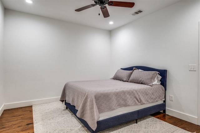 bedroom featuring ceiling fan and dark wood-type flooring