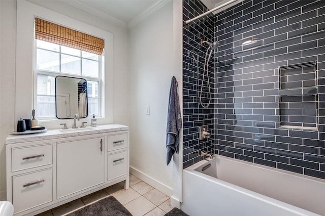 bathroom featuring tiled shower / bath, vanity, tile patterned floors, and crown molding